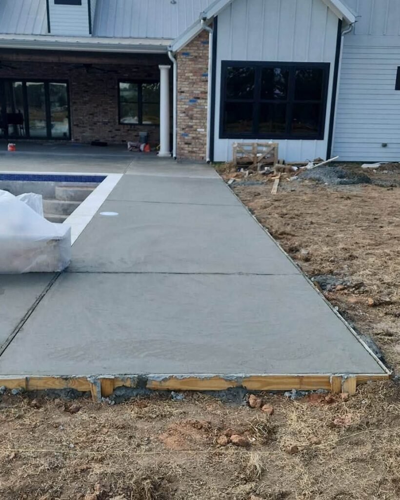 Custom concrete pool deck built for a Apex, North Carolina homeowner in Apex, NC
